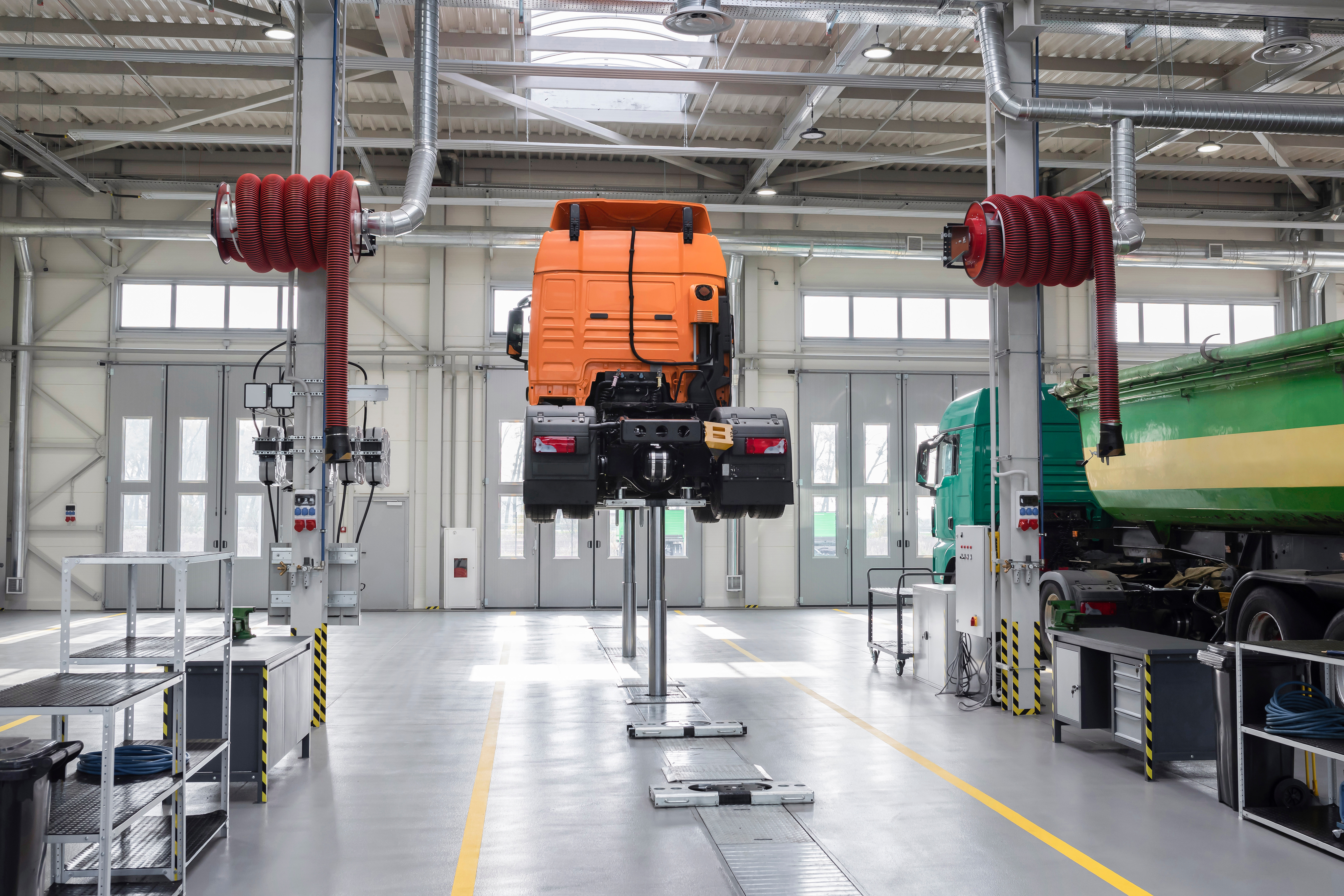 Truck at the service center. Servicing and repairing trucks in a large garage, diagnostics. Logistics and transport